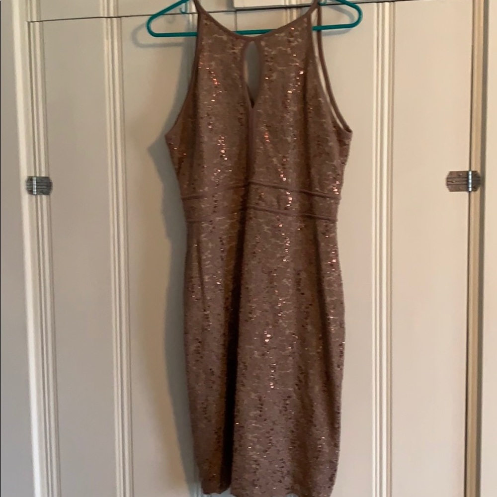 Lined, sequined knee-length dress.